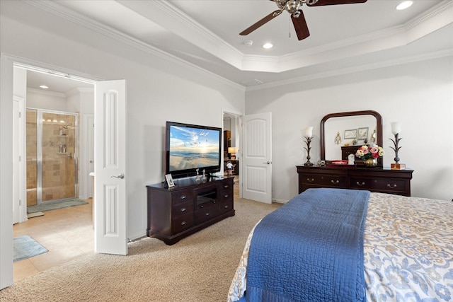 carpeted bedroom featuring baseboards, crown molding, and a raised ceiling