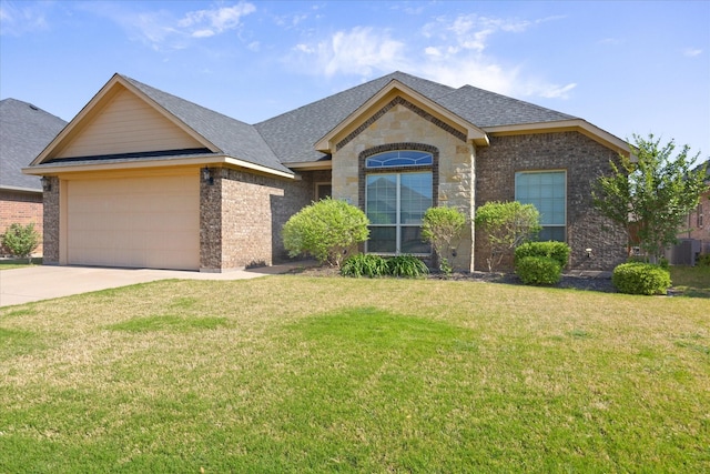 4425 Logan Cir, Granbury, TX 76049 - french provincial home featuring an attached garage, brick siding, driveway, a front lawn, and a shingled roof