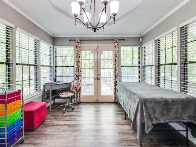 bedroom with french doors, multiple windows, and ornamental molding