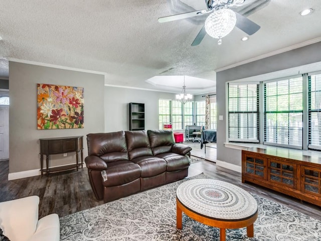 living area featuring ornamental molding, baseboards, wood finished floors, and a textured ceiling