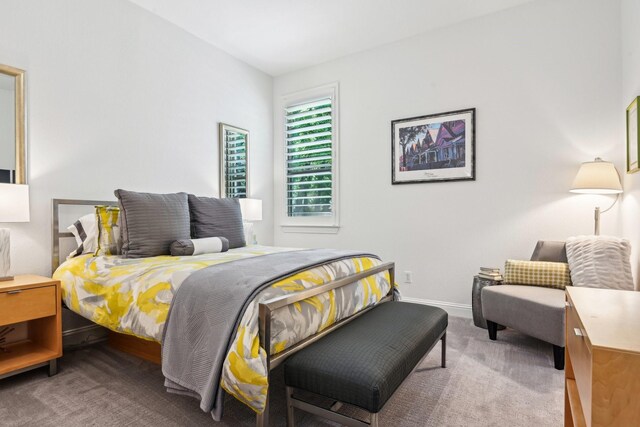 carpeted bedroom with baseboards