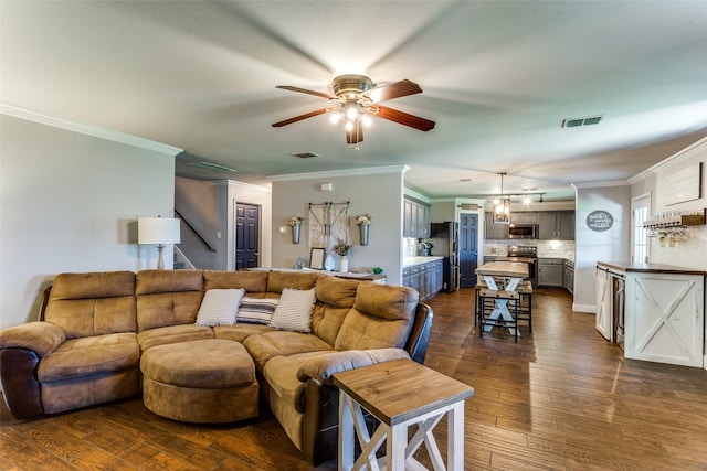 4505 Pangolin Dr, Fort Worth, TX 76244 - living area with dark wood-style flooring, a ceiling fan, crown molding, and visible vents