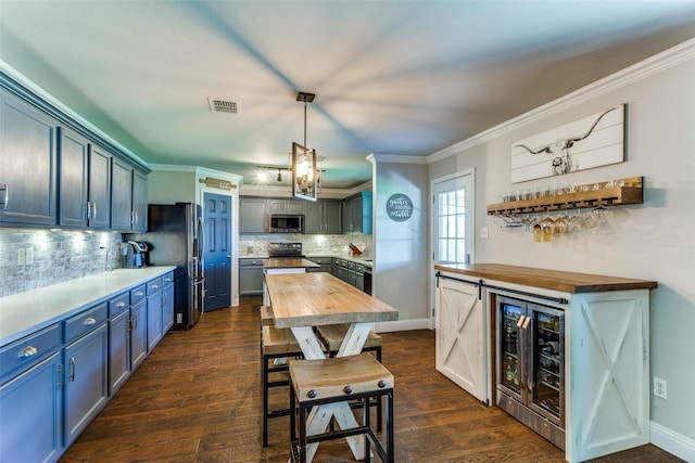 4505 Pangolin Dr, Fort Worth, TX 76244 - kitchen featuring visible vents, crown molding, butcher block counters, beverage cooler, and appliances with stainless steel finishes