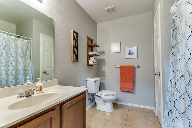 4505 Pangolin Dr, Fort Worth, TX 76244 - bathroom with tile patterned floors, toilet, visible vents, baseboards, and vanity