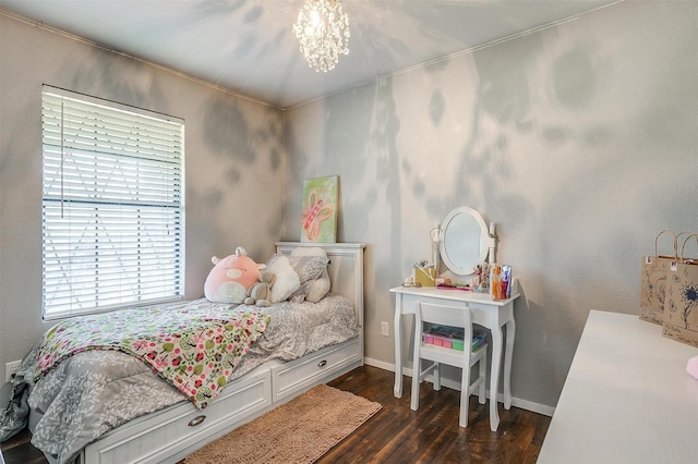 bedroom with a notable chandelier, baseboards, and dark wood-style flooring