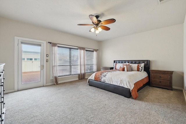 bedroom with ceiling fan, access to exterior, carpet flooring, and baseboards