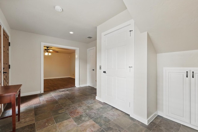 interior space with visible vents, baseboards, recessed lighting, and stone finish flooring