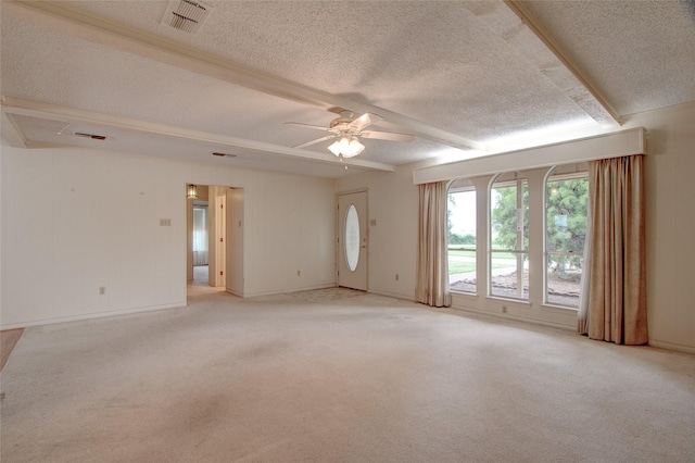 1001 S Sutton St, Mabank, TX 75147 - spare room with light carpet, a textured ceiling, a ceiling fan, beamed ceiling, and visible vents