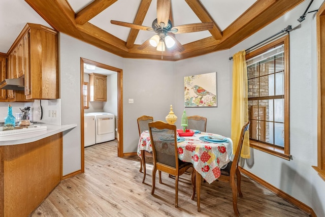 dining room featuring coffered ceiling, light wood-style floors, separate washer and dryer, and beamed ceiling