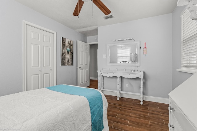 868 Briggs Blvd, East Tawakoni, TX 75472 - bedroom featuring ceiling fan, a closet, visible vents, wood finished floors, and baseboards