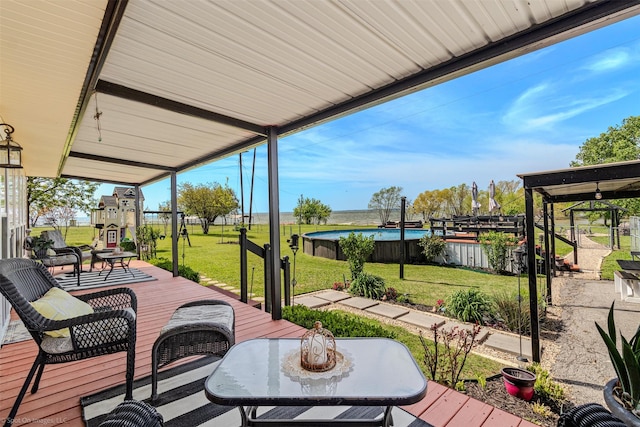 868 Briggs Blvd, East Tawakoni, TX 75472 - view of patio with an outdoor pool, a wooden deck, and fence