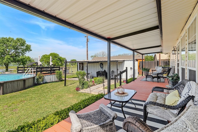 868 Briggs Blvd, East Tawakoni, TX 75472 - view of patio featuring a fenced in pool, an outdoor living space, an outbuilding, a deck, and fence