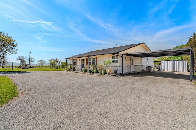 868 Briggs Blvd, East Tawakoni, TX 75472 - view of front facade with an outbuilding, fence, a storage unit, and aphalt driveway