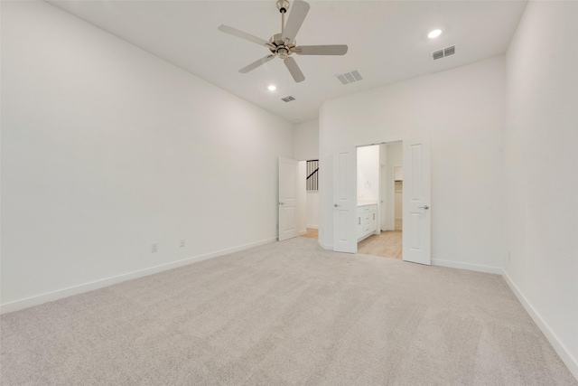 440 Lone Star Dr, Justin, TX 76247 - unfurnished bedroom with baseboards, visible vents, light colored carpet, and a towering ceiling