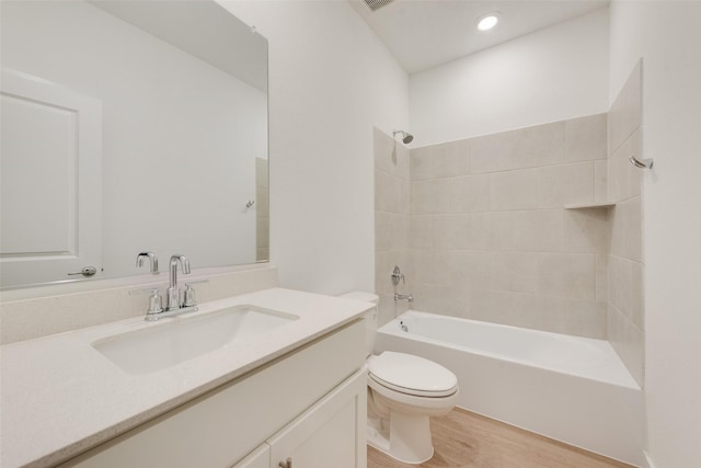 440 Lone Star Dr, Justin, TX 76247 - full bathroom with toilet, wood finished floors, visible vents, vanity, and shower / bathtub combination