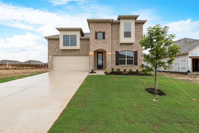 440 Lone Star Dr, Justin, TX 76247 - traditional-style home featuring concrete driveway, an attached garage, brick siding, and a front yard