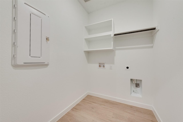 440 Lone Star Dr, Justin, TX 76247 - clothes washing area featuring light wood-style flooring, baseboards, washer hookup, hookup for an electric dryer, and laundry area