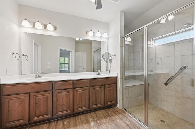 512 Hidden Springs Trl, Azle, TX 76020 - full bath with plenty of natural light, a shower stall, double vanity, and wood finished floors