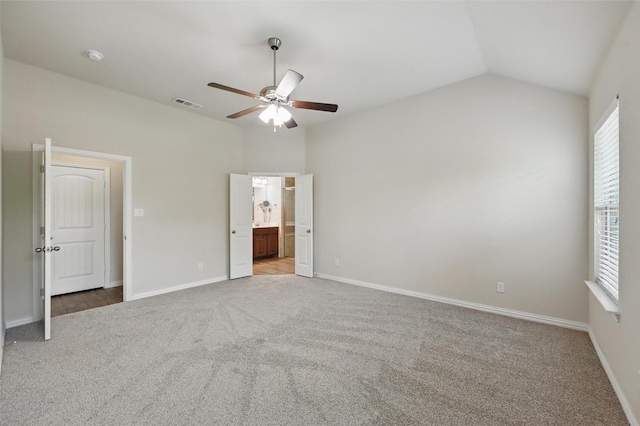 512 Hidden Springs Trl, Azle, TX 76020 - unfurnished bedroom with carpet, lofted ceiling, baseboards, ceiling fan, and ensuite bathroom