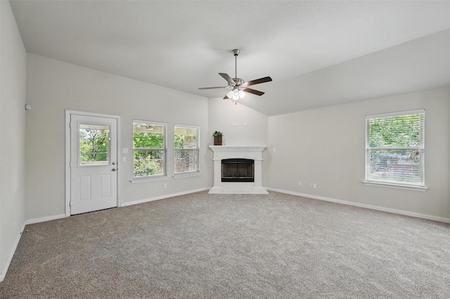 512 Hidden Springs Trl, Azle, TX 76020 - unfurnished living room featuring ceiling fan, carpet, vaulted ceiling, a fireplace with raised hearth, and baseboards
