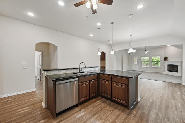 512 Hidden Springs Trl, Azle, TX 76020 - kitchen featuring stainless steel dishwasher, a sink, ceiling fan, arched walkways, and recessed lighting