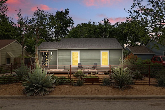 view of front of home with fence