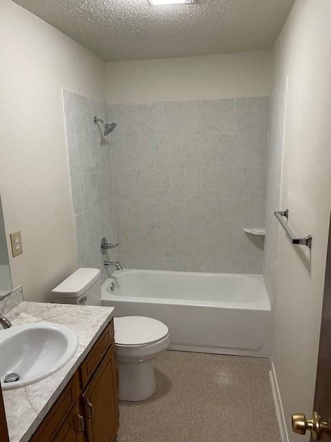 bathroom featuring toilet, vanity, tub / shower combination, and a textured ceiling