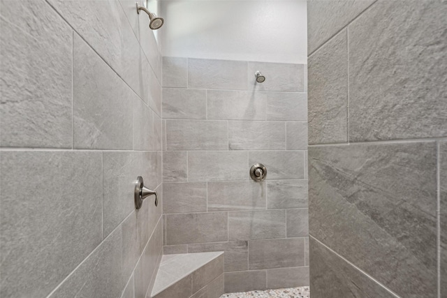 bathroom featuring a tile shower
