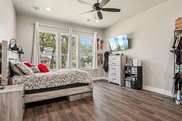 bedroom featuring dark wood-type flooring, baseboards, and visible vents