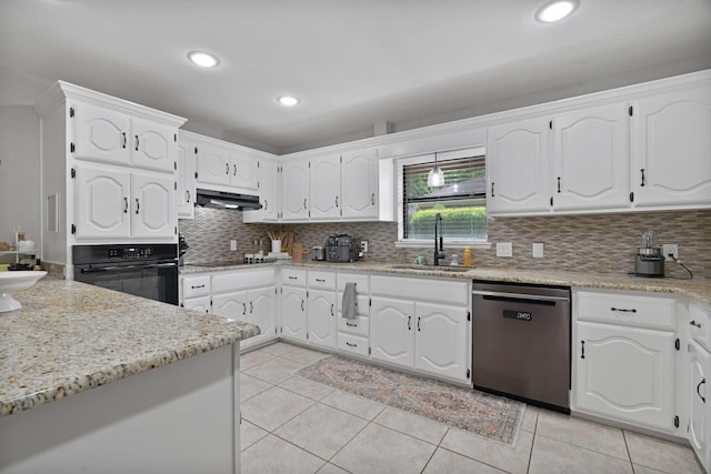kitchen featuring a sink, backsplash, black appliances, and under cabinet range hood