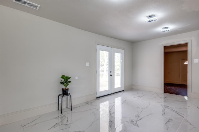 10061 Neosho Dr, Dallas, TX 75217 - interior space with marble finish floor, visible vents, baseboards, and french doors