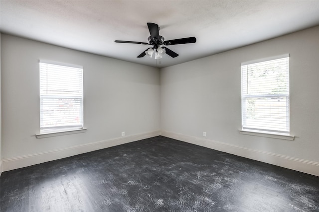 10061 Neosho Dr, Dallas, TX 75217 - empty room with plenty of natural light, baseboards, and ceiling fan