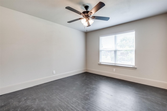 10061 Neosho Dr, Dallas, TX 75217 - unfurnished room featuring dark wood-style flooring, baseboards, and a ceiling fan
