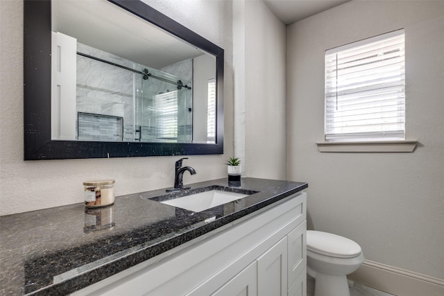 10061 Neosho Dr, Dallas, TX 75217 - full bath with a shower stall, vanity, baseboards, and toilet