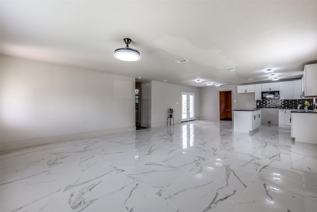 10061 Neosho Dr, Dallas, TX 75217 - unfurnished living room with visible vents and baseboards