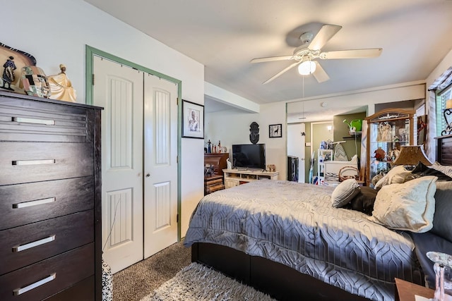 carpeted bedroom with a closet and ceiling fan