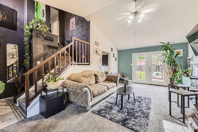 living room featuring a ceiling fan, visible vents, carpet flooring, stairs, and french doors