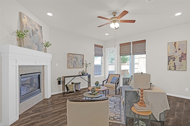 3341 Man O War Rd, Celina, TX 75009 - living room featuring a ceiling fan, dark wood-type flooring, baseboards, recessed lighting, and a glass covered fireplace