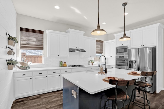 3341 Man O War Rd, Celina, TX 75009 - kitchen featuring stainless steel appliances, a sink, dark wood-style flooring, light countertops, and healthy amount of natural light