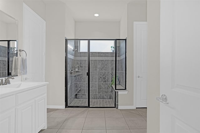 3341 Man O War Rd, Celina, TX 75009 - bathroom featuring a stall shower, vanity, baseboards, and tile patterned floors