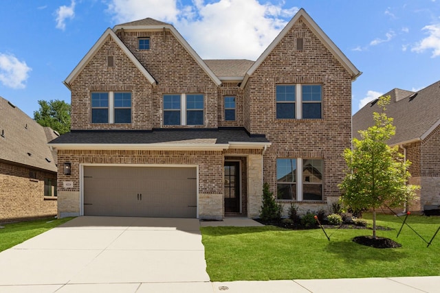view of front of home with brick siding, a front lawn, a garage, and concrete driveway