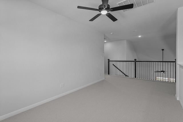 unfurnished room with baseboards, a ceiling fan, and carpet floors