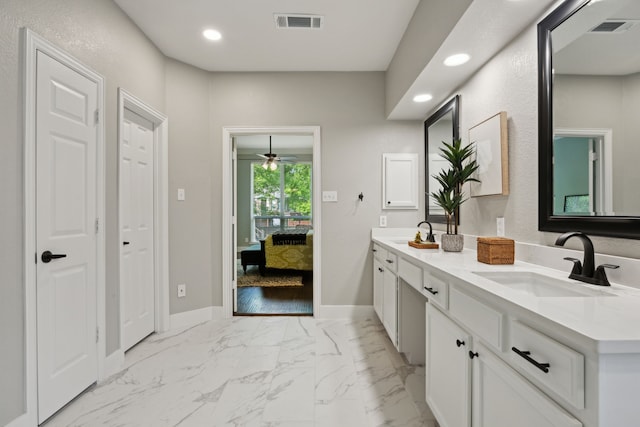 full bath with visible vents, a sink, and recessed lighting