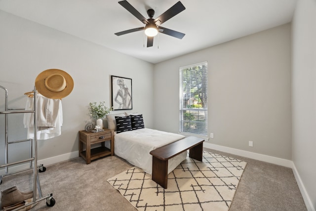 bedroom featuring carpet, a ceiling fan, and baseboards