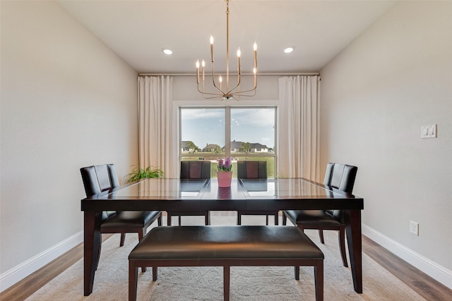 dining area featuring a chandelier, recessed lighting, baseboards, and light wood-style flooring