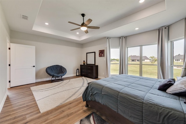 bedroom featuring recessed lighting, light wood-type flooring, and baseboards