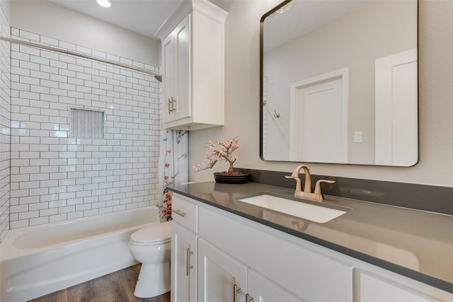 bathroom with toilet, shower / tub combo with curtain, recessed lighting, vanity, and wood finished floors