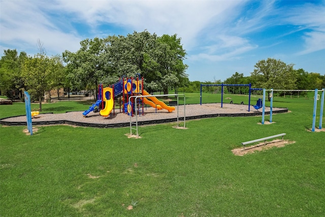 communal playground featuring a yard