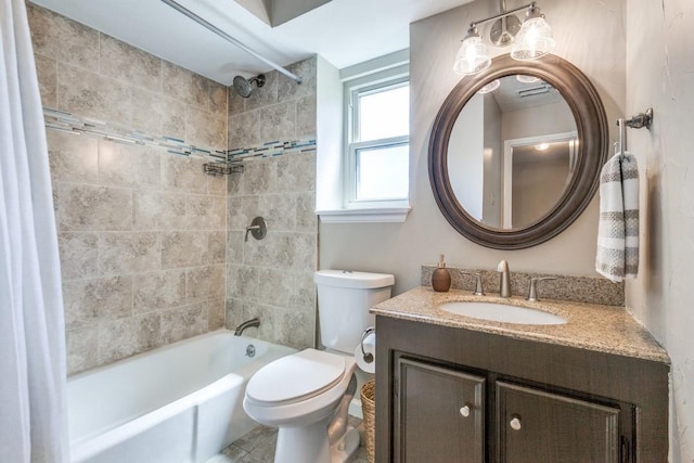 bathroom featuring vanity, toilet, and shower / bath combo