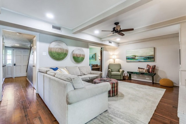 living room featuring beam ceiling, a ceiling fan, visible vents, and wood finished floors